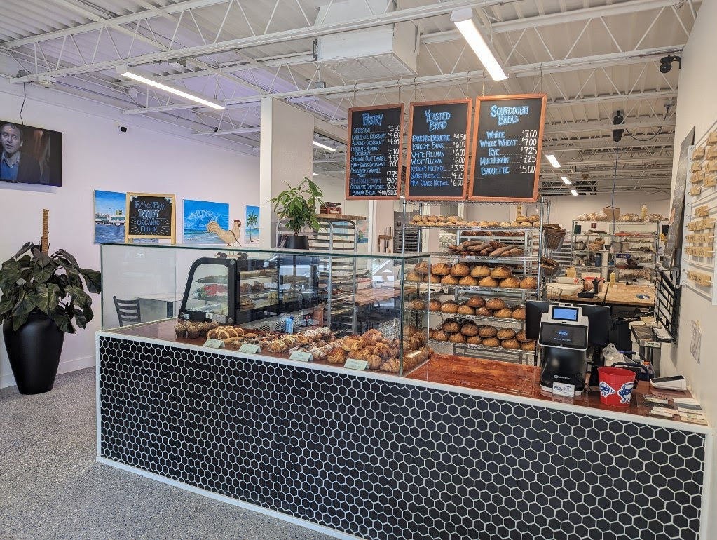 Bread Bandits bakery counter and bread display in Sarasota.